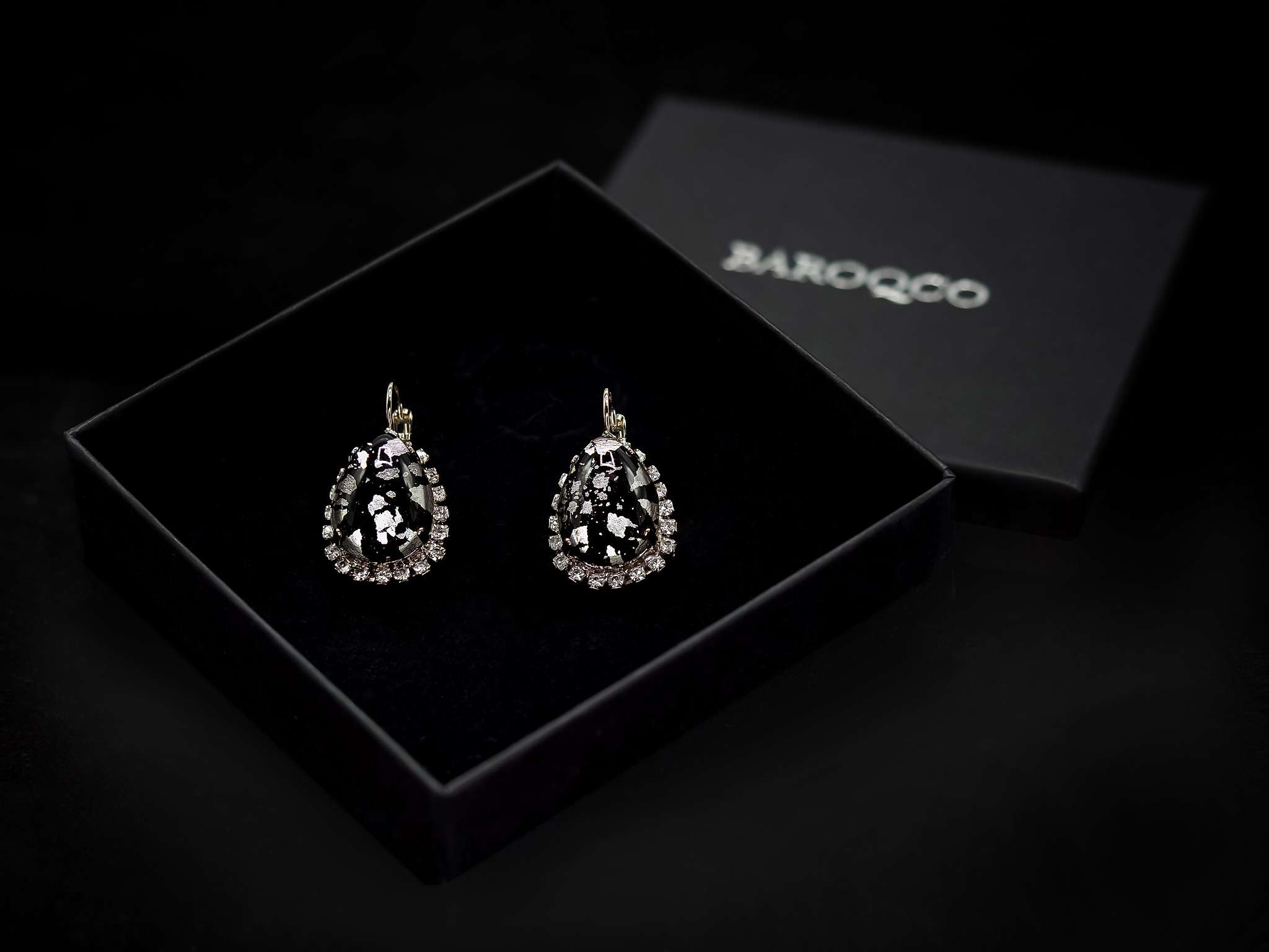 BAROQCO luxurious gift box featuring 'The Cruella' Bohemian stone statement earrings. These exquisite earrings showcase Swarovski crystals, genuine CRYSTAL®, semi-precious stones, and freshwater pearls, set in recycled silver or gold plating—nickel-free. A timeless expression of luxury, haute couture, and regal elegance.