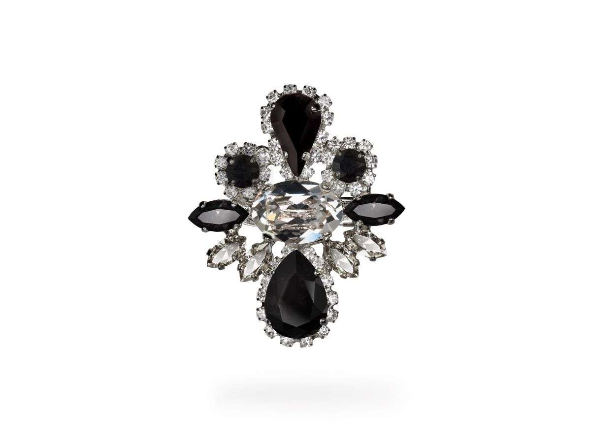 Presenting the Elegant Brooch from our PARADOX Collection. Elevate your style with this bold statement piece, crafted with genuine SWAROVSKI CRYSTALS© in Jet Crystal and Black Diamond. Made with nickel-free materials, it combines sophistication with comfort. Embrace timeless elegance with this stunning accessory.